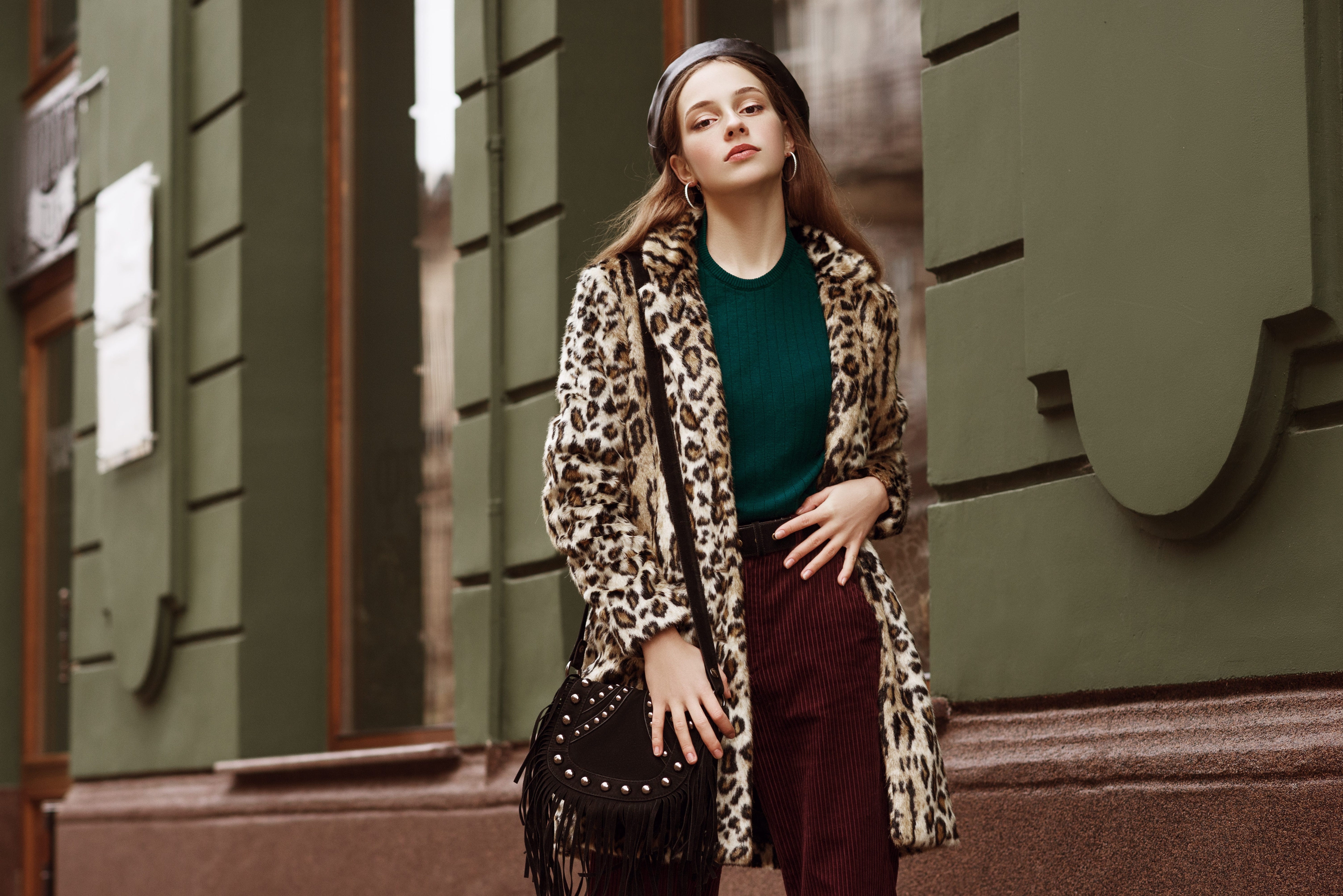 Woman wearing a stylish coat with a leopard print.jpg