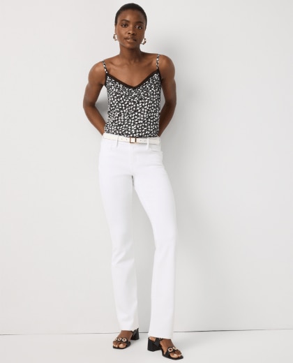 black patterned shirt and white pants
