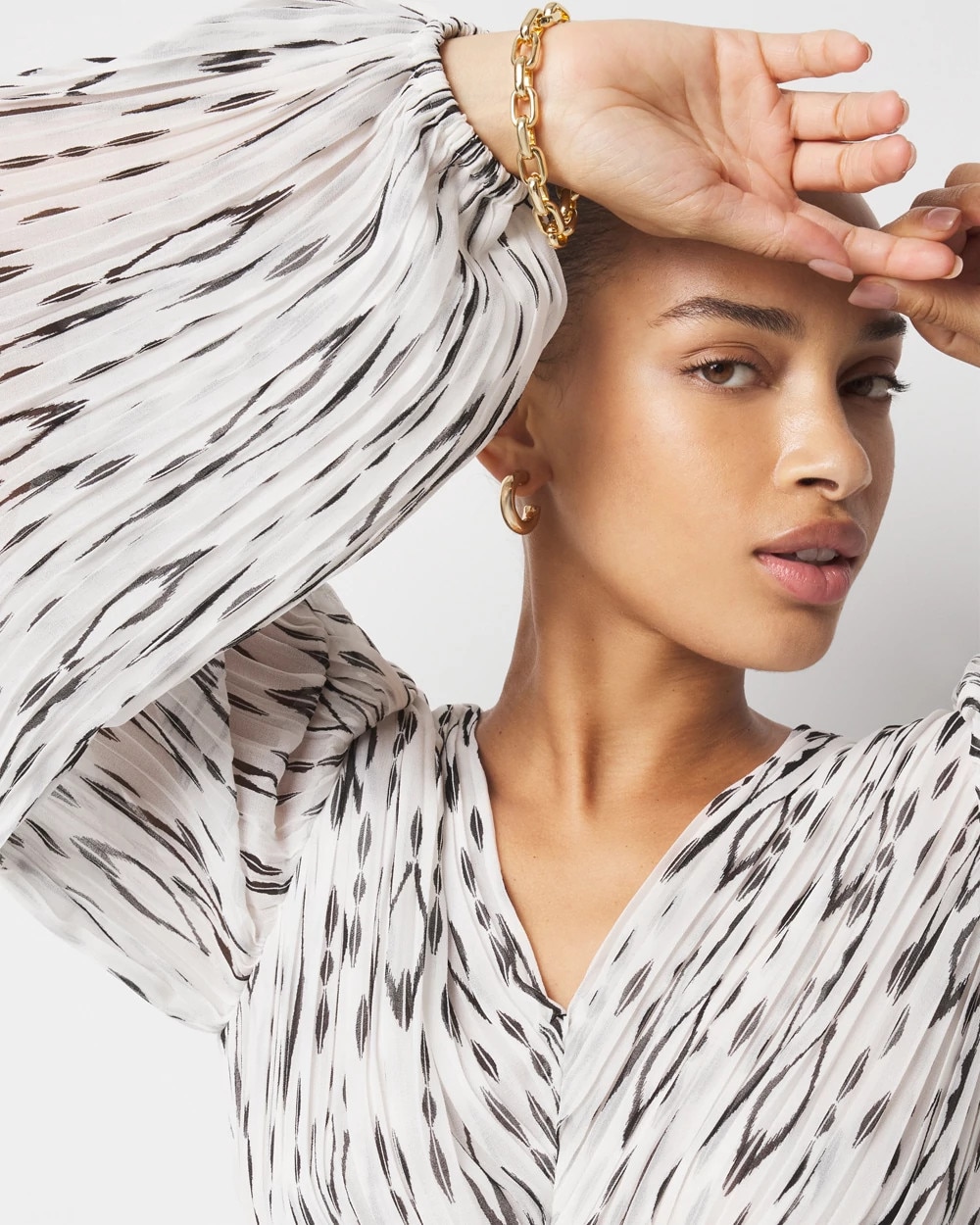 Ikat Pleated Peplum Blouse