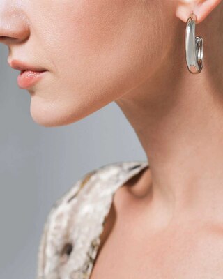 Silvertone Hammered Oval Hoop Earrings click to view larger image.